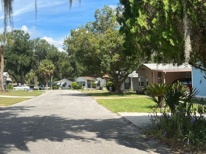 street in picciola landing with grassy lawns and homes