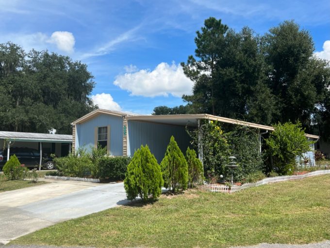 house with several bushes and plants