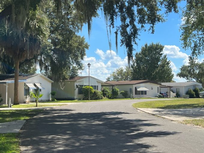 street in picciola landing with grassy lawns and homes