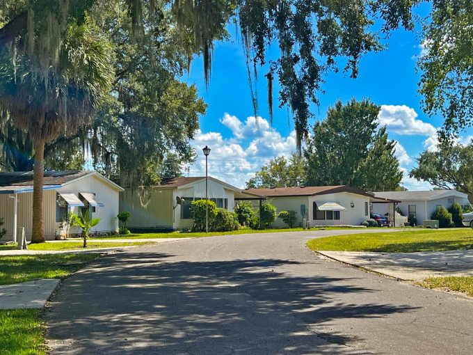 street in Picciola Landing with homes and grassy lawns